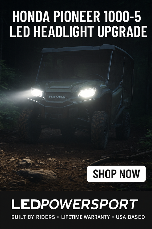 Honda Pioneer 1000-5 UTV on a rugged forest trail at night, outfitted with bright white LED headlights from LEDPowersport, promoting off-road visibility and powersport durability.