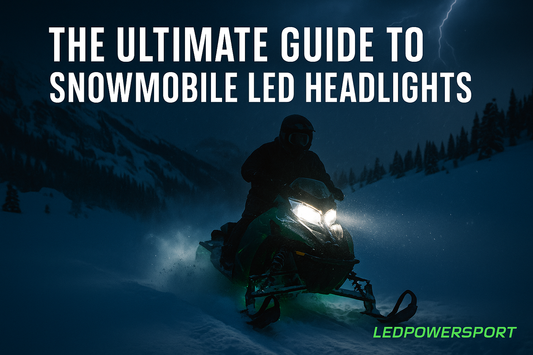 Snowmobile riding at night with bright white LED headlights and LEDPowersport branding in snowy mountain terrain