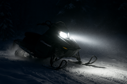 Snowmobile LED headlight conversion kit installed for bright white trail visibility at night