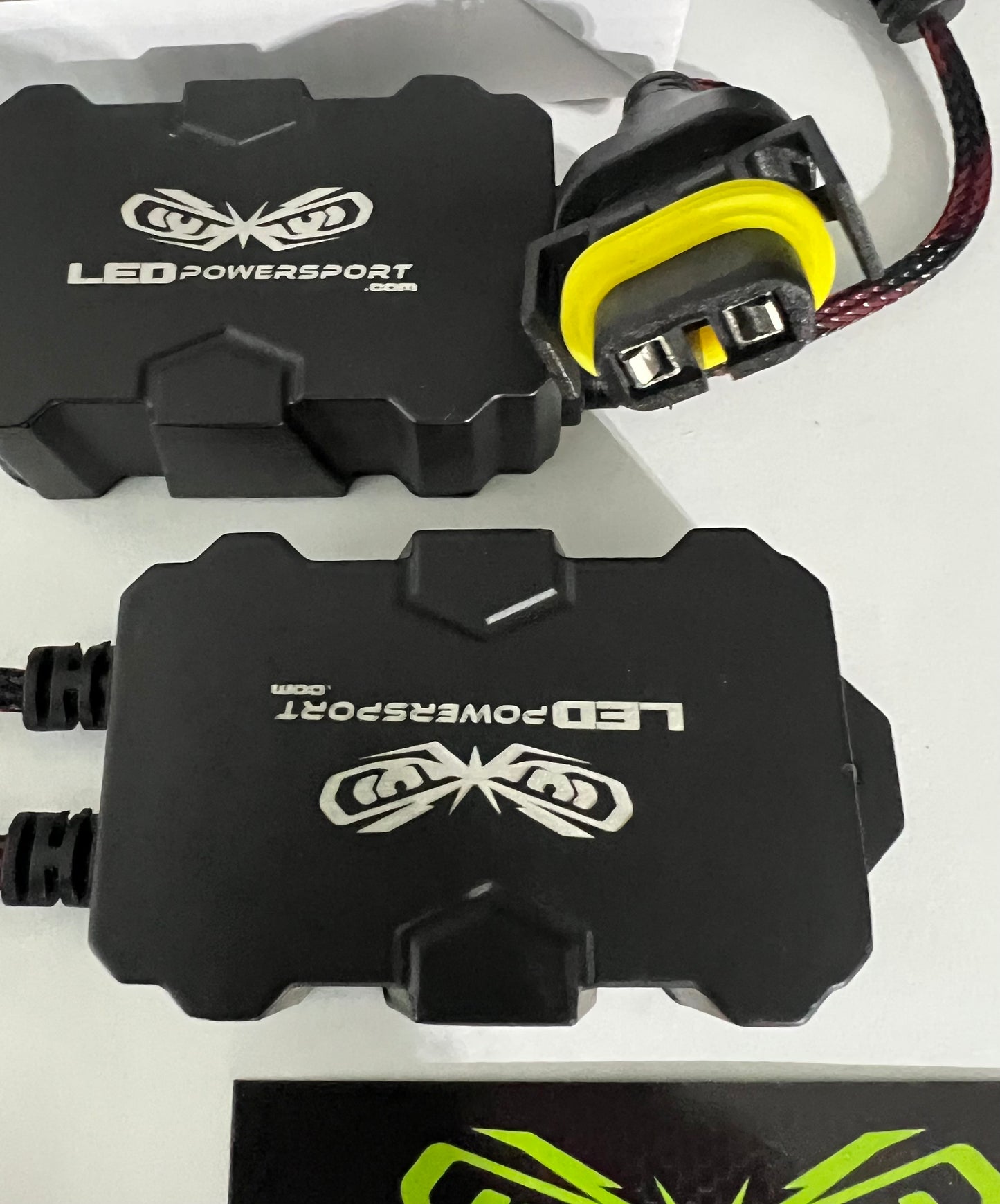 Close-up of 881 880 H11 AC to DC LED headlight rectifier plug with yellow seal – LEDPowersport powersport lighting accessory.
